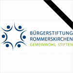 Logo der BürgerStiftung Rommerskirchen mit Trauerflor